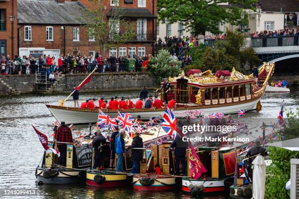 Gloriana, the Queen's Row Barge, passes under the Windsor Bridge at the head of the Platinum Jubilee Flotilla to mark Queen Elizabeth II's Platinum...
