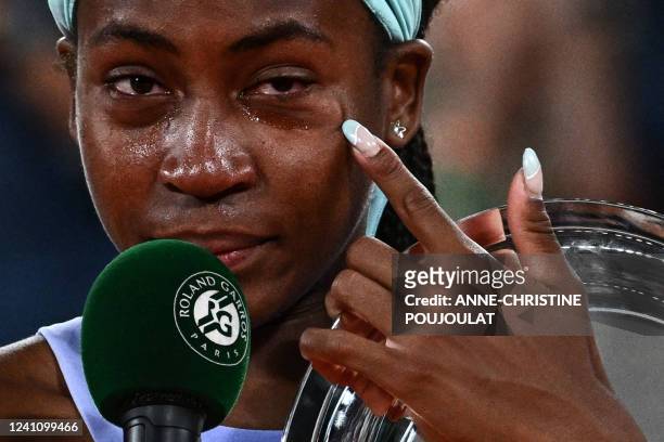 Coco Gauff reacts during the trophy ceremony after losing against Poland's Iga Swiatek at the end of their women's single final match on day fourteen...