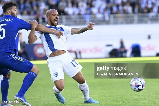 Bosnia-Herzegovina's defender Sead Kolasinac and Finland's defender Nikolai Alho vie for the ball during the UEFA Nations League football match...