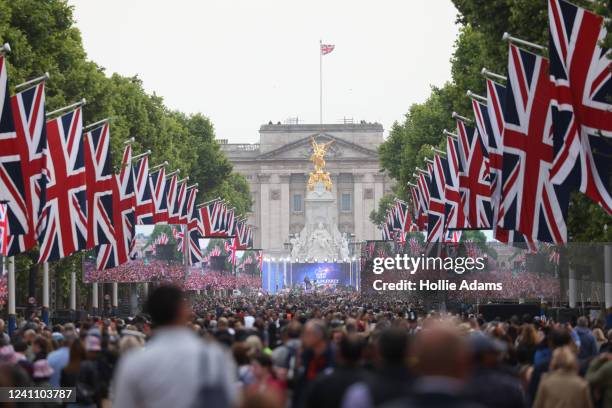 People gather along The Mall for the Platinum Party At The Palace concert outside Buckingham Palace on June 4, 2022 in London, United Kingdom. The...