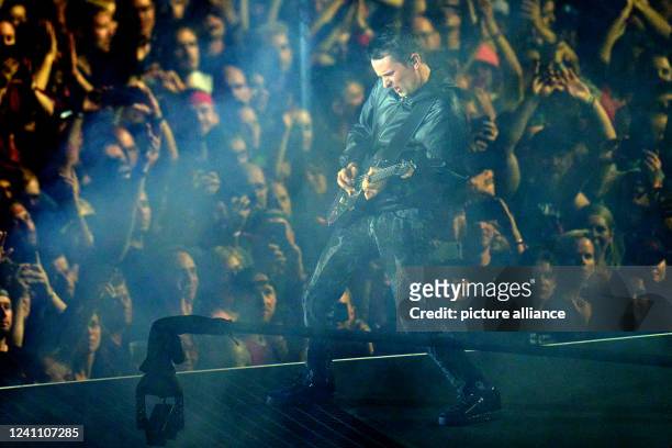 June 2022, Rhineland-Palatinate, Nürburg: Frontman Matthew Bellamy performs with the British rock band "Muse" on the main stage of the "Rock am Ring"...