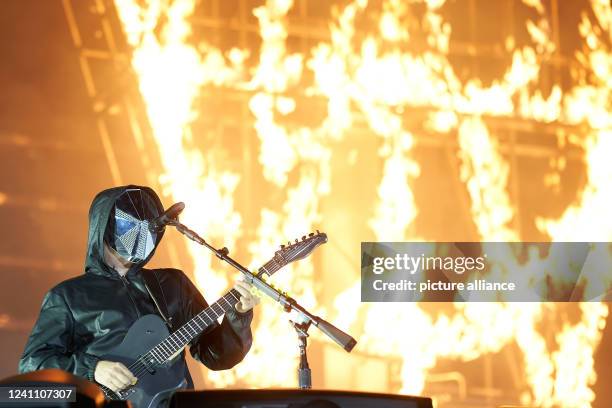 June 2022, Rhineland-Palatinate, Nürburg: Frontman Matthew Bellamy performs with the British rock band "Muse" on the main stage of the "Rock am Ring"...