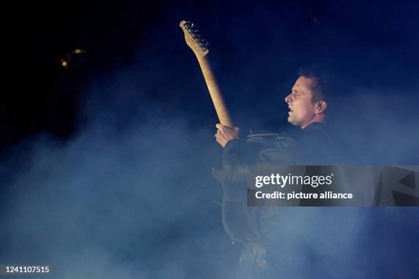 June 2022, Rhineland-Palatinate, Nürburg: Frontman Matthew Bellamy performs with the British rock band "Muse" on the main stage of the "Rock am Ring"...