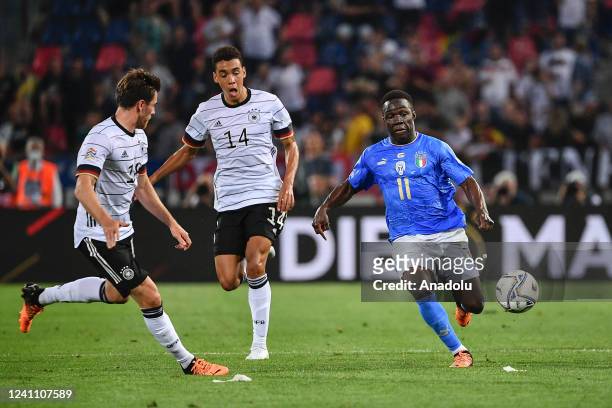 Degnand Wilfried Gnonto R), of Italy, is challenged by Janos Hofmann and Jamai Musiala , of Germany, during the UEFA Nations League football match...