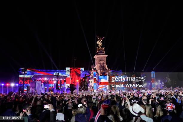 Camilla, Duchess of Cornwall and Prince Charles speak on stage during the Platinum Party At The Palace at Buckingham Palace on June 4, 2022 in...