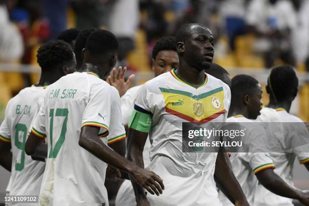 Senegalese captain Kalidou Coulibaly celebrates with his teammates at the Stade Me. Abdoulaye Wade in Diamniadio, on June 4 during the first day of...