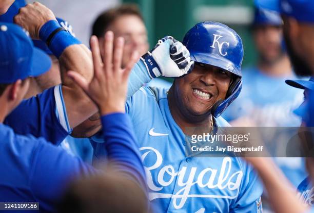 Salvador Perez of the Kansas City Royals is congratulated by teammates after hitting a home run against the Houston Astros during the sixth inning at...