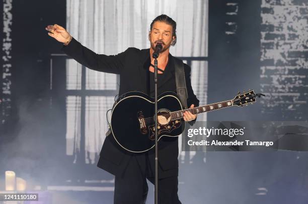 Musician Ricardo Arjona performs during the Blanco y Negro tour at FTX Arena on June 4, 2022 in Miami, Florida.