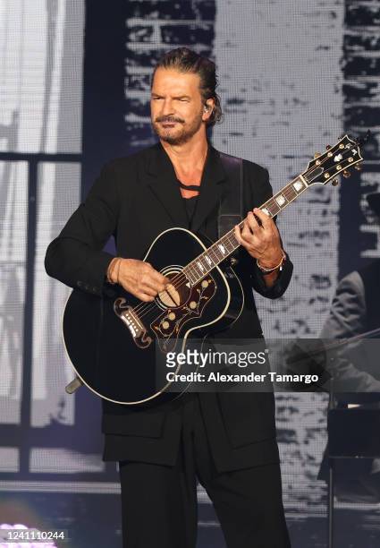 Musician Ricardo Arjona performs during the Blanco y Negro tour at FTX Arena on June 4, 2022 in Miami, Florida.