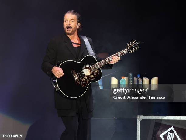 Musician Ricardo Arjona performs during the Blanco y Negro tour at FTX Arena on June 4, 2022 in Miami, Florida.