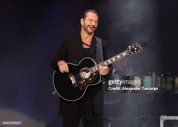 Musician Ricardo Arjona performs during the Blanco y Negro tour at FTX Arena on June 4, 2022 in Miami, Florida.