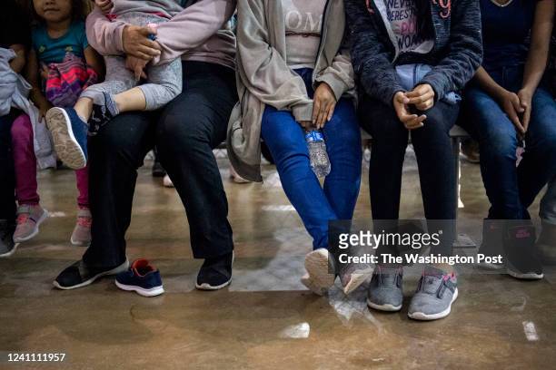 Recently detained migrants, many of them family units, sit and await processing in the US Border Patrol Central Processing Center in McAllen, Texas...