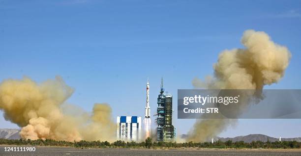 The rocket carrying the Shenzhou-14 mission with three Chinese astronauts lifts off at the Jiuquan Satellite Launch Center in Northwest Chinas Gansu...