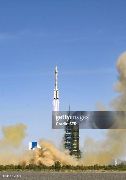 The rocket carrying the Shenzhou-14 mission With three Chinese astronauts lifts off at the Jiuquan Satellite Launch Center in Northwest Chinas Gansu...