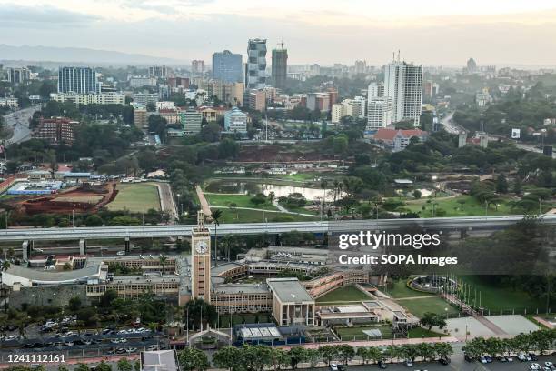 An aerial view of the modern Nairobi cityscape with the Nairobi express way passing through the capital city of Kenya, East Africa. The name Nairobi...