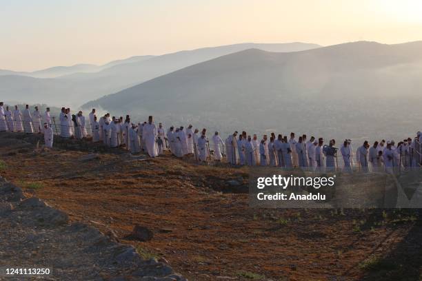 Samaritan men gather to pray at Mount Gerizim during the Shavuot, the Feast of Weeks in the West Bank city of Nablus on June 05, 2022.