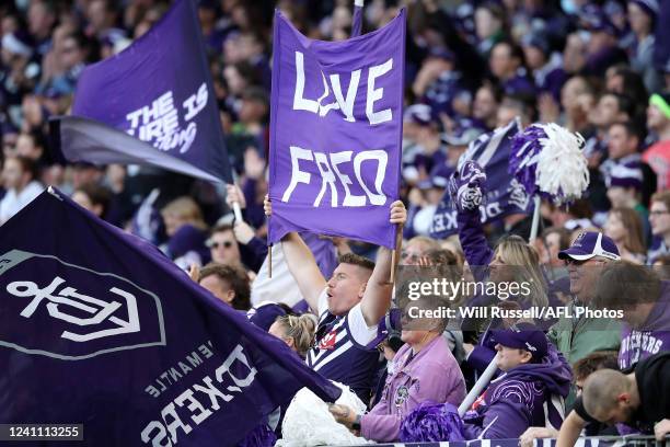 The Fremantle cheer squad celebrate a goal during the 2022 AFL Round 12 match between the Fremantle Dockers and the Brisbane Lions at Optus Stadium...