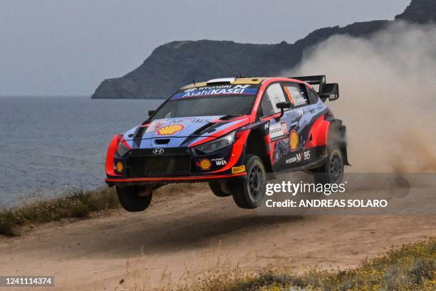 Estonian driver Ott Tanak steers his Hyundai assisted by his co-driver Martin Jarveoja, on June 5, 2022 during the SS19 special between Sassari and...