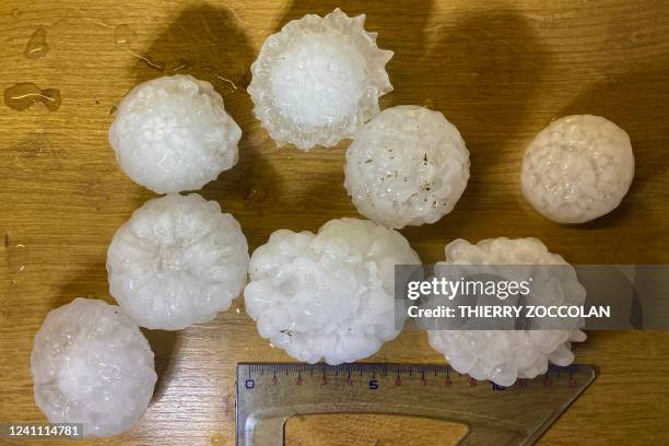 Picture taken on June 4, 2022 shows hail stones felt during a storm in Vensat, central France. Storms broke across large parts with France...