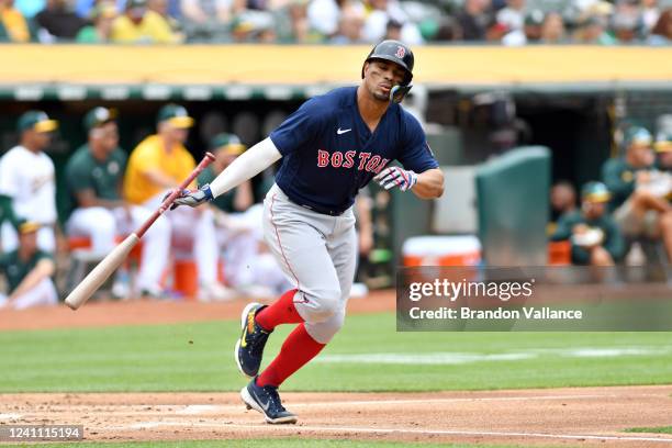 Xander Bogaerts of the Boston Red Sox reacts after hitting a fly ball against the Oakland Athletics at RingCentral Coliseum on June 4, 2022 in...