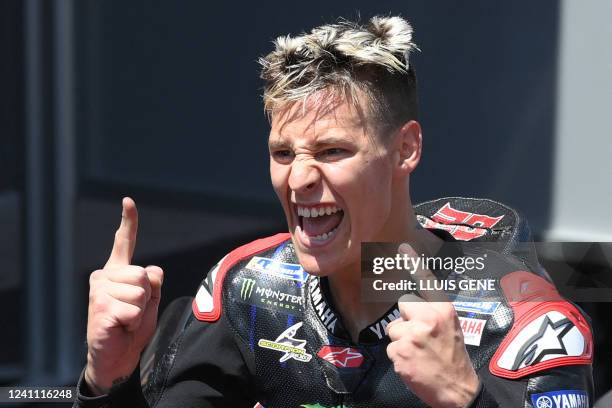 Yamaha French rider Fabio Quartararo celebrates after winning the Moto Grand Prix de Catalunya at the Circuit de Catalunya on June 5, 2022 in...