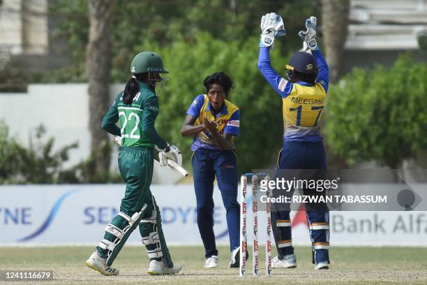 Sri Lanka's cricketers celebrate the dismissal of Pakistan Sidra Nawaz during the third and final one-day international womens cricket match between...