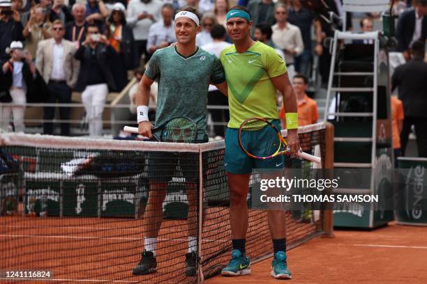 Spain's Rafael Nadal and Norway's Casper Ruud pose before the start of the men's singles final match between on day fifteen of the Roland-Garros Open...