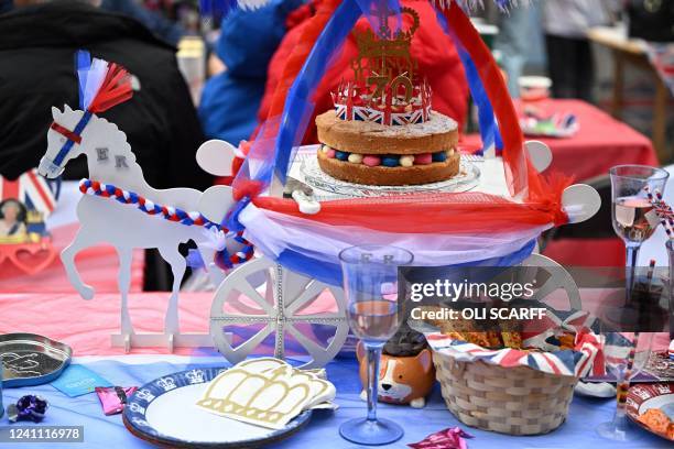 Food and drinks are displayed on tables during a street party in Ashby-de-la-Zouch in central England on June 5, 2022 as part of Queen Elizabeth II's...