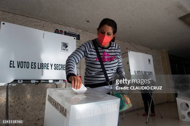 Woman casts her ballot during regional elections in Tizayuca, Hidalgo State, Mexico, on June 5, 2022. - Voters in six of Mexico's 32 states vote this...
