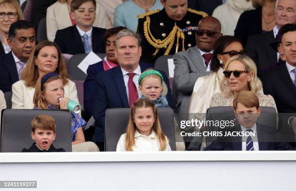 Britain's Prince Louis of Cambridge , Britain's Princess Charlotte of Cambridge and Britain's Prince George of Cambridge attend the Platinum Pageant...