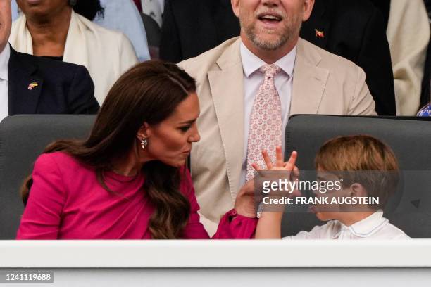 Britain's Catherine, Duchess of Cambridge, and her son Britain's Prince Louis of Cambridge react during the Platinum Pageant in London on June 5,...