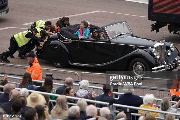 People push a classic car carrying The Great British Bake Off judge Prue Leith after it broke down during the Platinum Jubilee Pageant in front of...