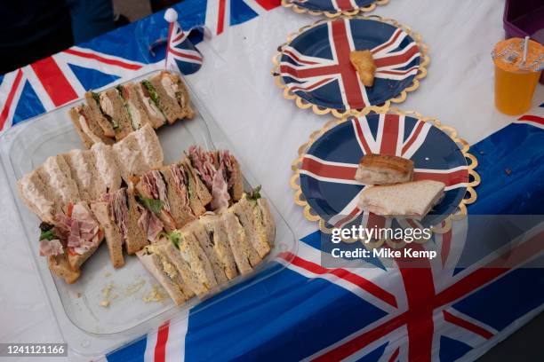 Trays of sandwiches outside Turners Old Star pub on Wapping Green, Watts Street E1 for the Platinum Jubilee Lunch & Street Party, which is part of...