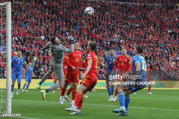Wales' goalkeeper Wayne Hennessey jumps to deflect the balll during the FIFA World Cup 2022 play-off final qualifier football match between Wales and...