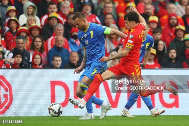 Ukraine's striker Andriy Yarmolenko fights for the ball with Wales' defender Neco Williams during the FIFA World Cup 2022 play-off final qualifier...
