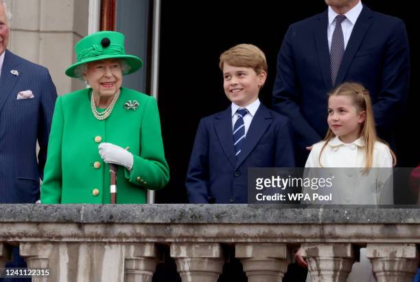Queen Elizabeth II, Prince George of Cambridge and Princess Charlotte of Cambridge stand on the balcony of Buckingham Palace duringduring the...