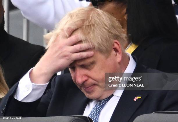 In this file photo taken on June 5, 2022 shows Britain's Prime Minister Boris Johnson reacts during the Platinum Pageant in London on June 5, 2022 as...