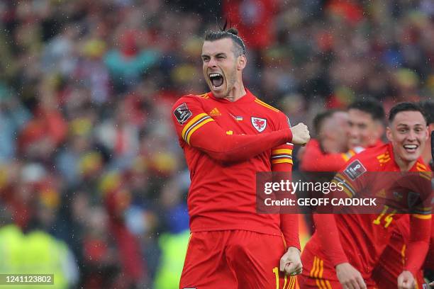 Wales' striker Gareth Bale celebrates after winning the FIFA World Cup 2022 play-off final qualifier football match between Wales and Ukraine at the...