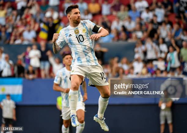 Argentina's forward Lionel Messi celebrates after scoring his team's first goal during the international friendly football match between Argentina...