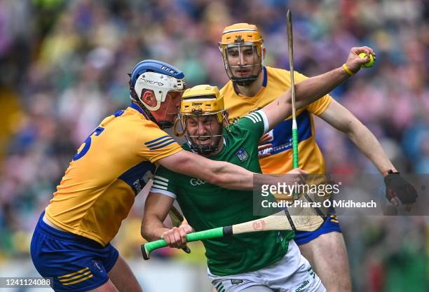 Tipperary , Ireland - 5 June 2022; Tom Morrisey of Limerick in action against Clare players Diarmuid Ryan, left, and David Fitzgerald of Clare during...