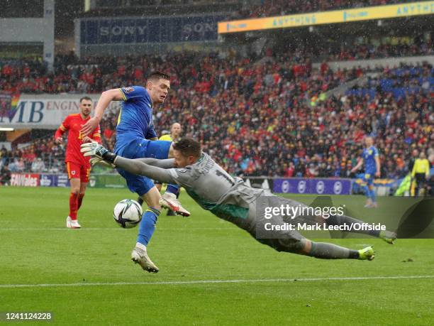 Welsh goalkeeper Wayne Hennessey saves from Viktor Tsygankov of Ukraine during the FIFA World Cup Qualifier Play-Off Final match between Wales and...