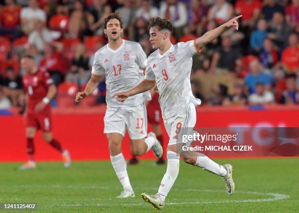 Spain's midfielder Pablo Gavi celebrates scoring the 1-1 goal with Spain's defender Marcos Alonso Mendoza during the UEFA Nations League - League A...