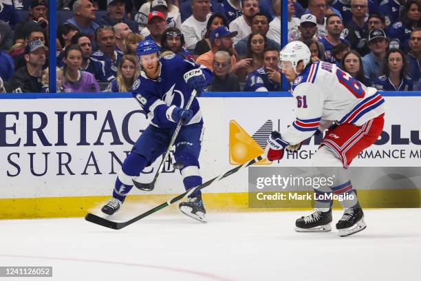 Riley Nash of the Tampa Bay Lightning skates against Justin Braun of the New York Rangers during the first period in Game Three of the Eastern...