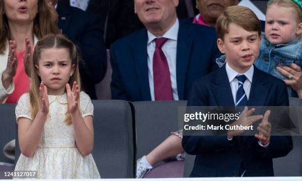 Prince George of Cambridge and Princess Charlotte of Cambridge attend the Platinum Pageant on The Mall on June 5, 2022 in London, England. The...