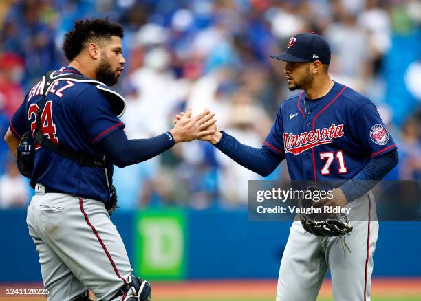 Gary Sanchez of the Minnesota Twins celebrates the victory with pitcher Jovani Moran following a MLB game against the Toronto Blue Jays at Rogers...