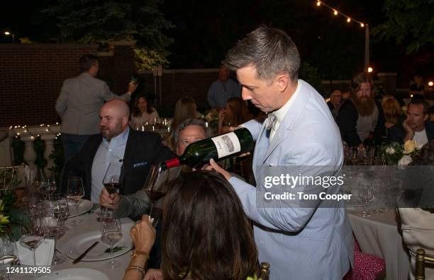 Littleton, Colorado Mayor Kyle Schlachter pours wine for guests celebrating Jordan Vineyard & Winery Gather In The Garden Top Chef Dinner & Auction...