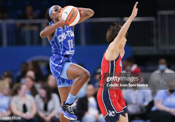 Chicago Sky guard Dana Evans shoots a half court shot during a WNBA game between the Washington Mystics and Chicago Sky on June 5 at Wintrust Arena...