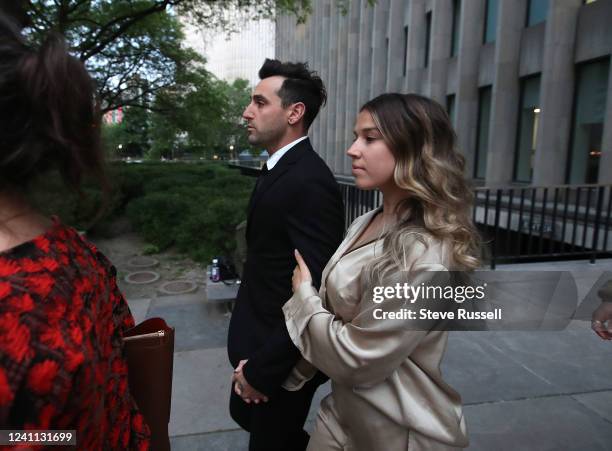 Frontman for the band Hedley, Jacob Hoggard, leaves court with his wife Rebekah at 361 University Avenue after being found guilty of sexual assault...