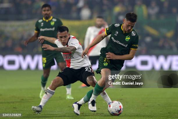 Nicolas Tripichio of Defensa y Justicia competes for the ball with Esequiel Barco of River Plate during a match between Defensa y Justicia and River...