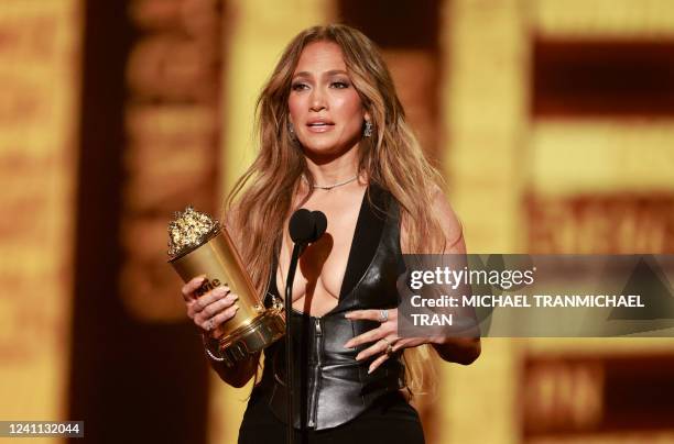 Actress-singer Jennifer Lopez recieves the MTV Generation Award on stage during the MTV Movie and TV Awards at the Barker Hangar in Santa Monica,...